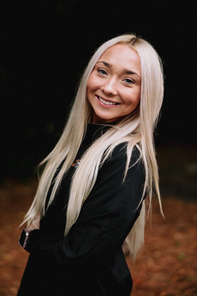 Young female dental assistant smiling